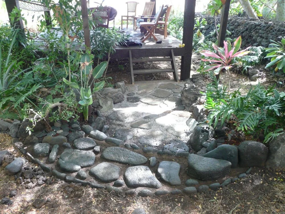 A garden path and porch at Kipukamaluhia